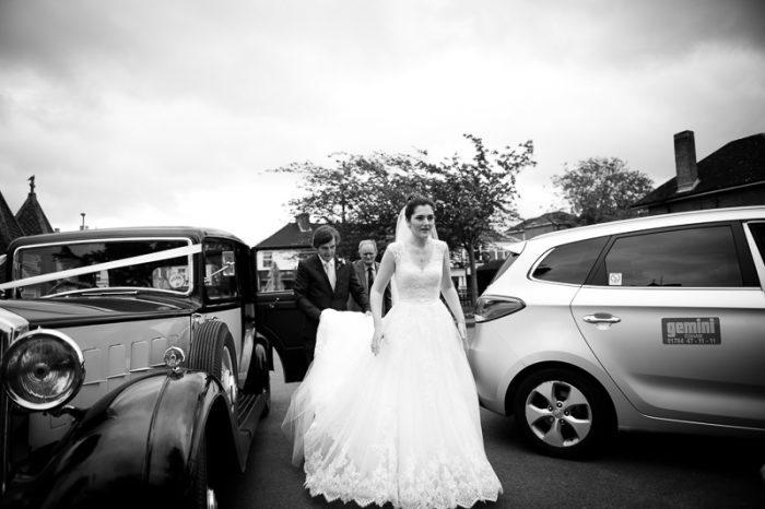 Bride getting out of the car at Englefield Green