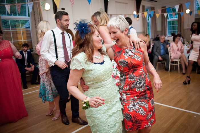 Wedding guests enjoying the dancing at village hall wedding