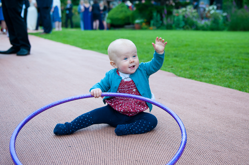 Baby playing with hula hoop at Ridge Farm