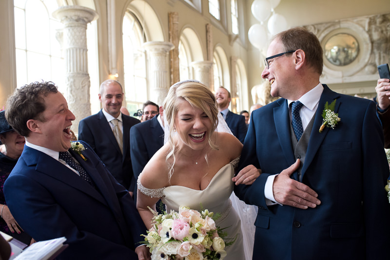Bride and groom giggling during the wedding ceremony
